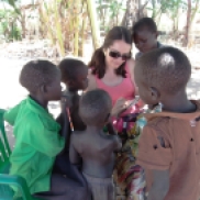 Always a teacher... helping out children with some extra homework during a teaching visit to South Sudan.