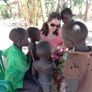 Always a teacher... helping out children with some extra homework during a teaching visit to South Sudan.